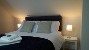Rooms - Double room En suite shower room with hand basin and WC. Writing desk and chair. Tea and coffee making facilities, free WiFi and smart TV with Netflix.